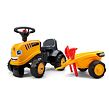 FALK Odrážedlo traktor Baby JCB žlutý s vozíkem a lopatou s hráběmi